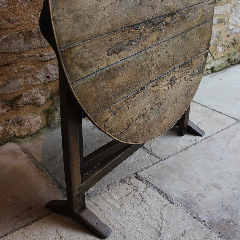 incredibly-attractive-wine-tasting-table-vendange-table-vineyards-france-french-19th-century-easily-stored-away-tilting-mechanism-top-orientated-upright-position-constructed-from-mixed-hardwoods-wonderful-time-worn-patina-historic-repairs-remnants-old-paint-occasional-table-good-condition-useful-home-damon-blandford-antiques-interior-design-chic-vintage-for-sale-cotswolds-gloucestershire-patena-look-interior-design-damon-blandford-antiques-country-house-garden-furniture-for-sale