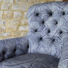 Load image into Gallery viewer, victorian-deep-button-back-upholstered-armchair-beautiful-shape-turned-legs-front-square-legs-rear-original-brass-castors-chair-professionally-re-upholstered-stunning-ludhiana-wool-fabric-intricate-decoration-inspiration-traditional-indian-patterns-swirling-floral-design-blue-cream-colourway-stylish-chair-elegant-design-english-late-victorian-damon-blandford-antiques-for-sale-the-malthouse-collective-stroud-gloucestershire-cotswolds-for-sale-antique-seating
