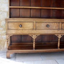 Load image into Gallery viewer, welsh-dresser-and-&amp;-rack-fabulous-original-sun-bleached-colour-rack-moulded-cornice-above-frieze-blacksmith-forged-iron-cup-hooks-over-three-shelves-base-three-drawers-equal-length-original-turned-wooden-drawer-pulls-inlaid-mother-pearl-decoration-ring-turned-supports-carved-spandrels-pot-board-raised-bracket-feet-dresser-originates-mid-wales-newtown-powys-circa-1810-incredibly-attractive-damon-blandford-antiques-for-sale-stroud-gloucestershire
