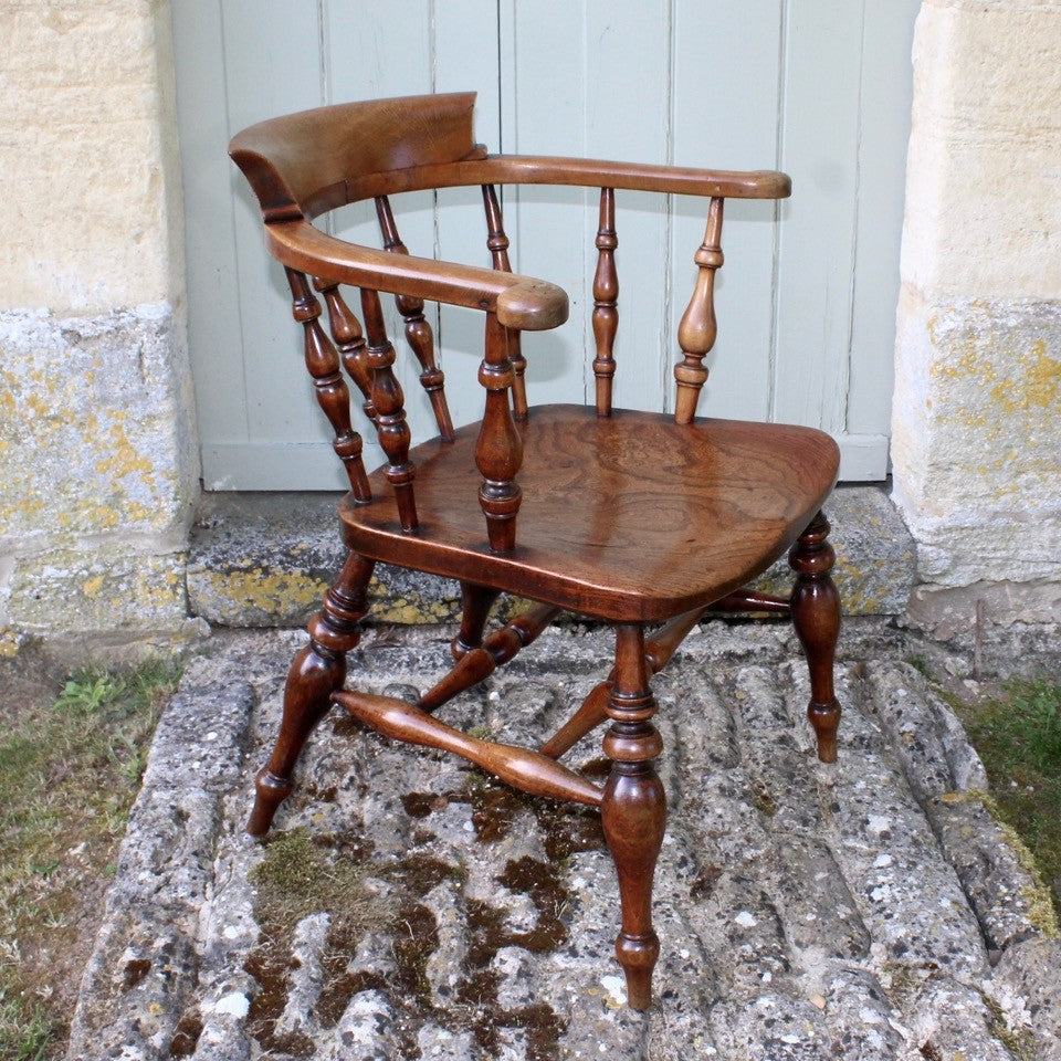 19th-century-beech-and-elm-captains-smokers-bow-armchair-good-colour-chair-constructed-beech-saddled-seat-carved-slab-elm-ring-turned-legs-united-double-H-stretcher-good-solid-comfortable-chair-excellent-condition-damon-blandford-antiques-stroud-gloucestershire-cotswolds-seating-for-sale