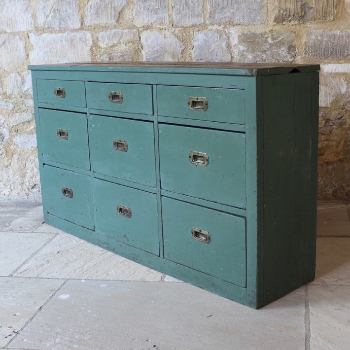 really-useful-bank-nine-drawers-original-recessed-brass-handles-planked-back-shallow-drawers-deepe-drawers-made-from-pine-dovetail-joint-construction-certainly-commercial-use-retail-useful-domestic-setting-narrow-proportions-good-solid-usable-condition-green-paint-time-worn-finish-aesthetic-appeal-English-late-19th-Century-damon-blandford-antiques-storage-for-sale-stroud-gloucestershire