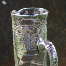 Load image into Gallery viewer, attractive-american-art-nouveau-riven-glass-claret-jug-silver-overlay-jug-cylindrical-form-small-lipped-spout-spread-base-c-scroll-handle-silver-overlay-intricate-design-featuring-grapes-vine-leaves-heart-shape-cartouche-exceptionally-good-quality-excellent-condition-turn-of-19th-20th-century-for-sale-damon-blandford-antiques-stroud-gloucestershire-cotswolds

