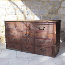 Load image into Gallery viewer, very-rustic-19th-century-bank-of-twelve-drawers-constructed-of-painted-pine-metal-drop-handles-decorative-foliate-design-drawers-retaing-original-planked-pine-top-back-boards-truly-wonderful-appearance-commercial-use-furniture-tremendous-aesthetic-appeal-for-sale-damon-blandford-antiques-storage-stroud-stow-on-the-wold-gloucestershire-cotswolds
