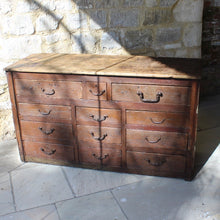 Load image into Gallery viewer, very-rustic-19th-century-bank-of-twelve-drawers-constructed-of-painted-pine-metal-drop-handles-decorative-foliate-design-drawers-retaing-original-planked-pine-top-back-boards-truly-wonderful-appearance-commercial-use-furniture-tremendous-aesthetic-appeal-for-sale-damon-blandford-antiques-storage-stroud-stow-on-the-wold-gloucestershire-cotswolds

