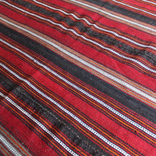 Load image into Gallery viewer, attractive-flatweave-kilim-striped-design-predominantly-shades-red-orange-brown-white-grey-rug-five-long-narrow-lengths-carefully-sewn-together-kilim-nomadic-tribe-camel-table-rug-sitting-floor-communal-bowl-food-good-hard-wearing-kilim-stylish-picnic-rug-turkish-for-sale-damon-blandford-antiques-vintage-kilims-carpets-rugs-stroud-stow-on-the-wold-cotswolds-interiors-design
