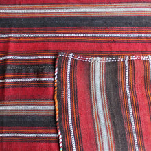 Load image into Gallery viewer, attractive-flatweave-kilim-striped-design-predominantly-shades-red-orange-brown-white-grey-rug-five-long-narrow-lengths-carefully-sewn-together-kilim-nomadic-tribe-camel-table-rug-sitting-floor-communal-bowl-food-good-hard-wearing-kilim-stylish-picnic-rug-turkish-for-sale-damon-blandford-antiques-vintage-kilims-carpets-rugs-stroud-stow-on-the-wold-cotswolds-interiors-design

