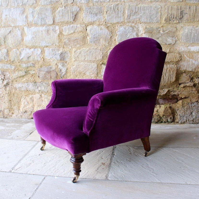 Low Victorian upholstered armchair